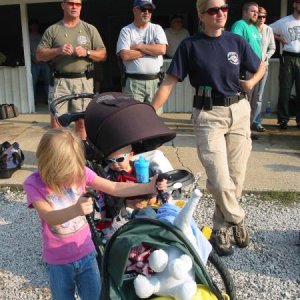 My beautiful wife and children at a 2008 Wabash Valley USPSA match.  We go to matches as a family and try to make it fun for the kids.  They like help