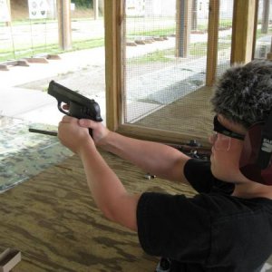 My boy with the S&W 2214 immediately after a shot.
