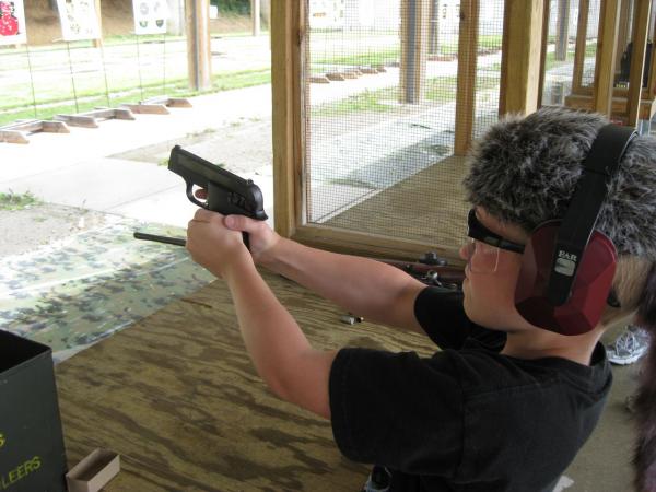 My boy with the S&W 2214 immediately after a shot.