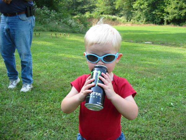 My son at a 2008 Wabash USPSA match.  He loves Monster soda, but he didn't sleep for 3 days... (Just kidding, the can was empty!)