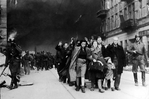 Jewish+civilians+marched+out+of+Warsaw+by+Nazi+troops
