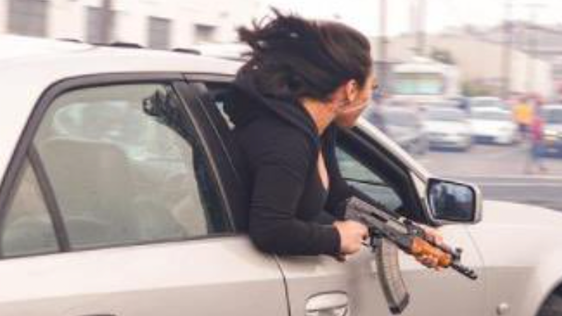 Woman-leans-out-passenger-window-with-AK47-in-San-Francisco.png