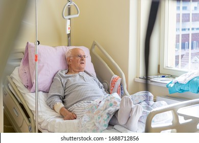 elderly-man-laying-on-bed-260nw-1688712856.jpg
